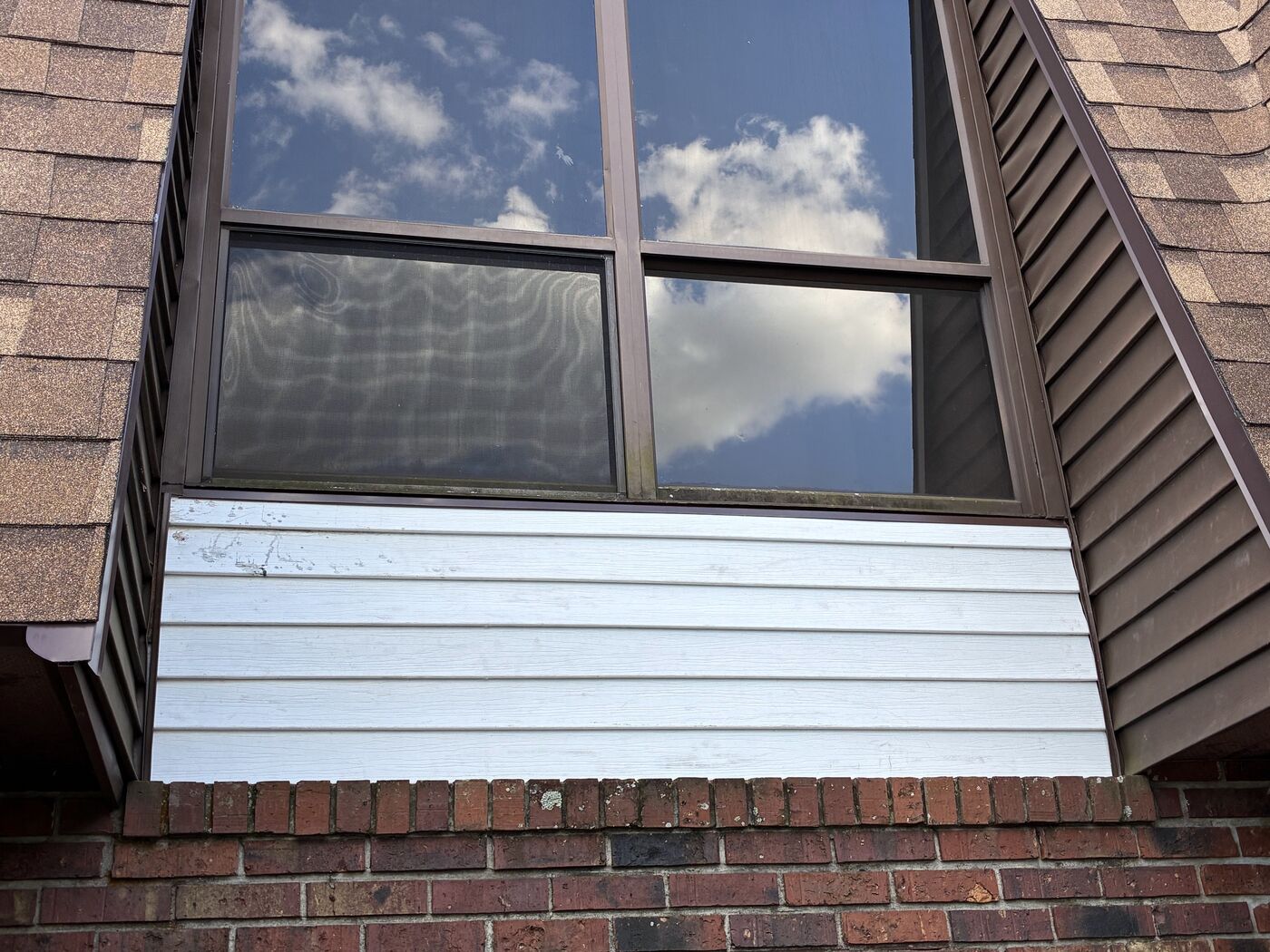 New siding installed and painted under the window